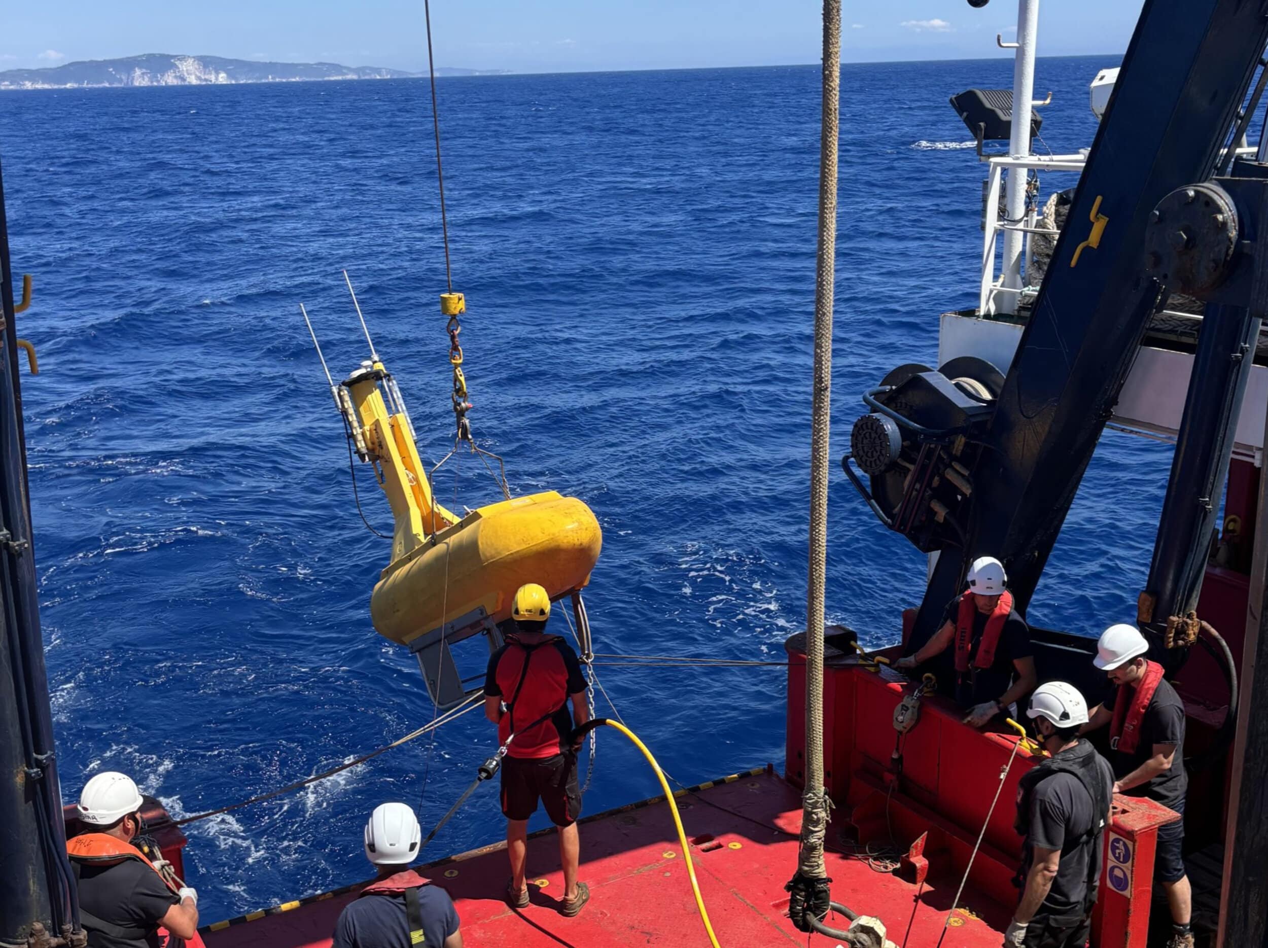 Crew deploys ocean-bottom seismic equipment during the ODISSEY mission in the Ionian Sea.