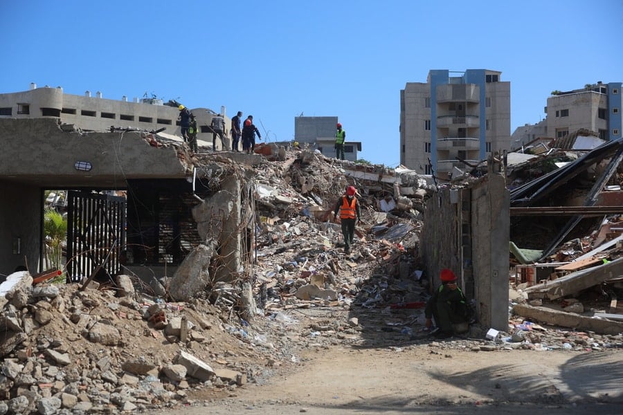 Rescue workers search through the rubble of a collapsed building after the deadly Venezuela earthquakes.