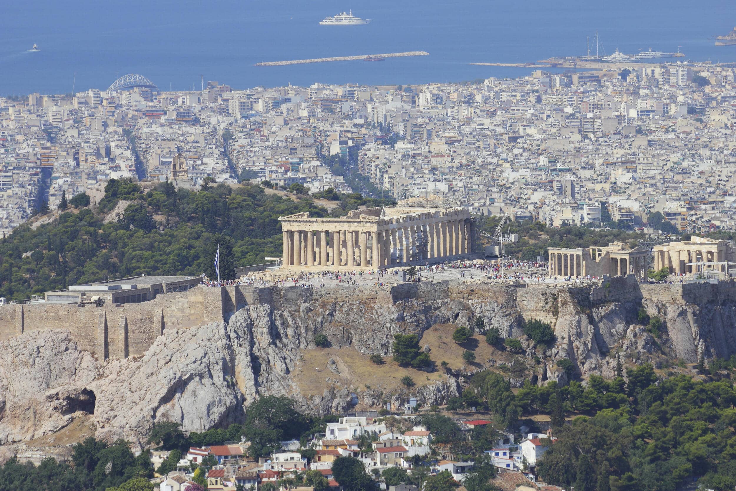 The Acropolis and Parthenon overlooking Athens and the Saronic Gulf on a clear summer day.