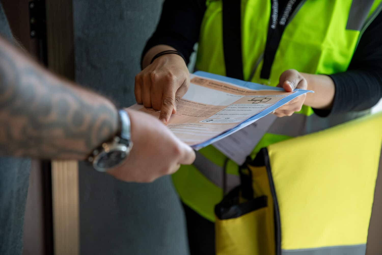 A Census worker assists a resident with a form during preparations for Australia’s 2026 national count.