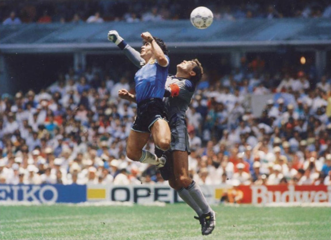 Diego Maradona scores his infamous &ldquo;Hand of God&rdquo; goal at the 1986 World Cup