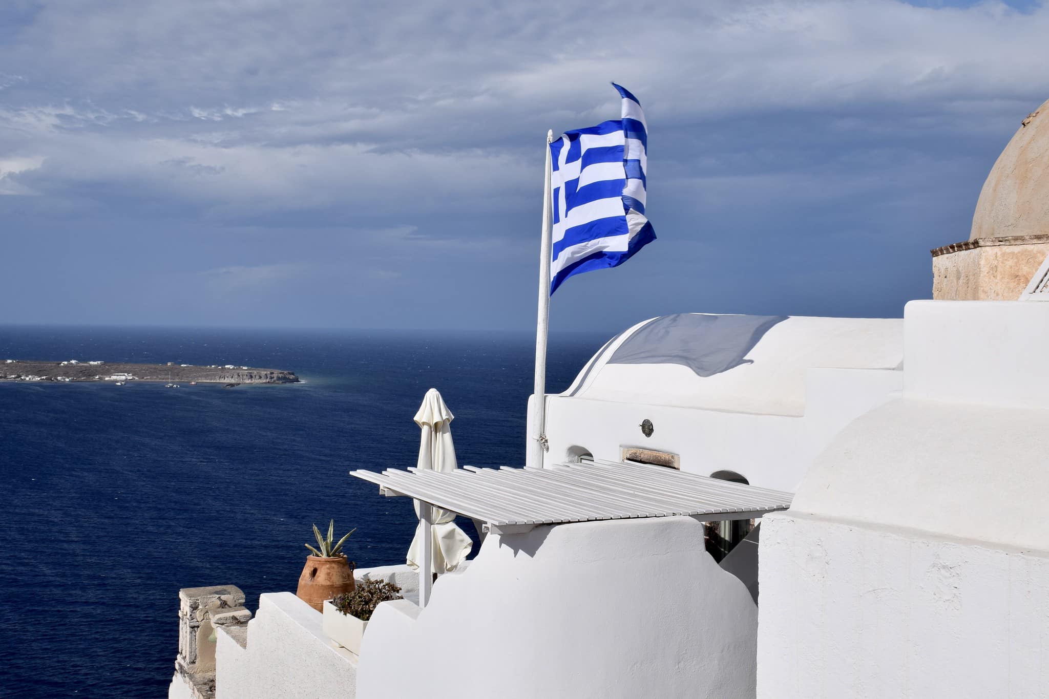 Greek flag at Oia on the Greek island of Santorini