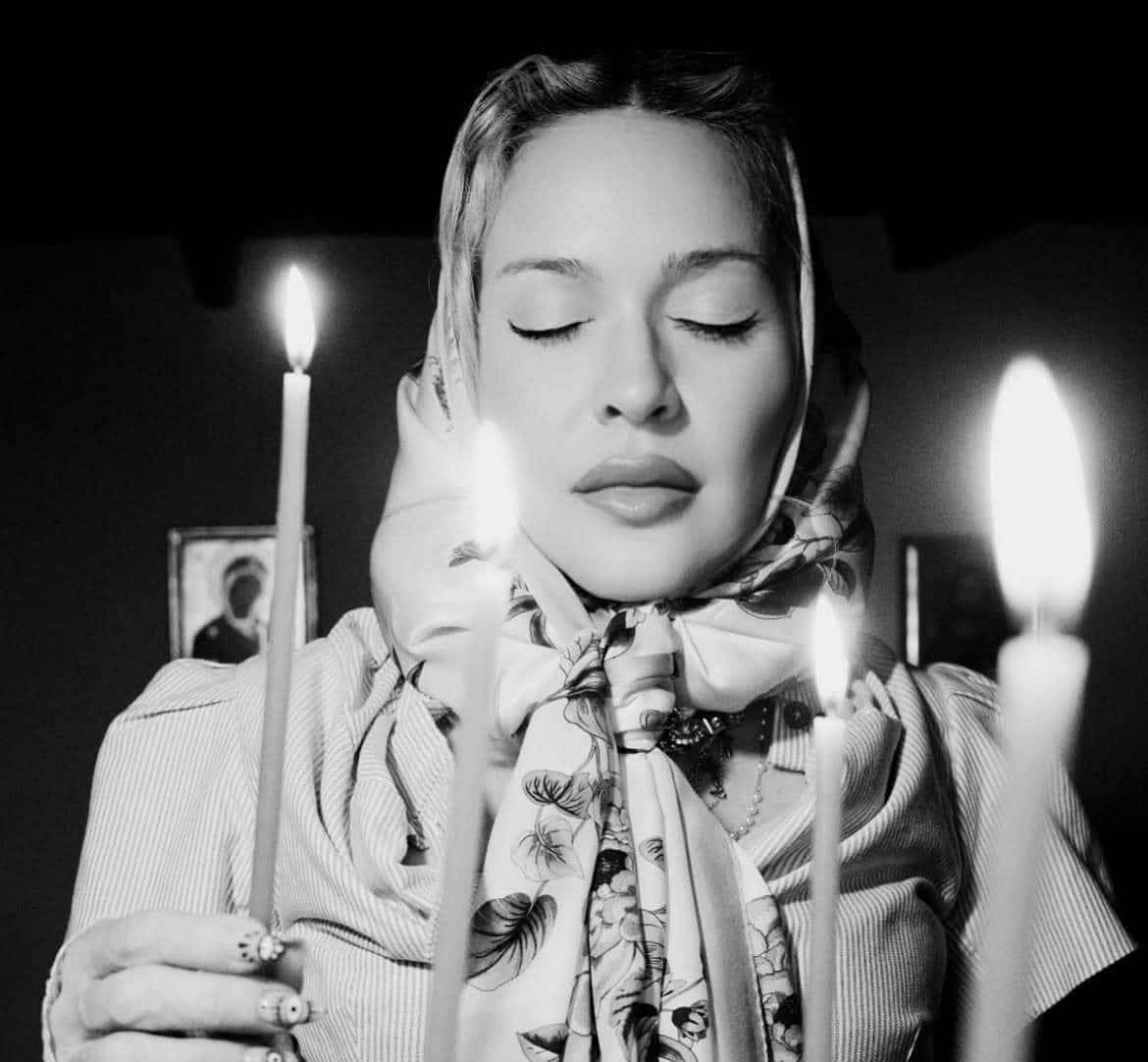 Madonna lights a candle during her spiritual visit to Patmos, Greece.