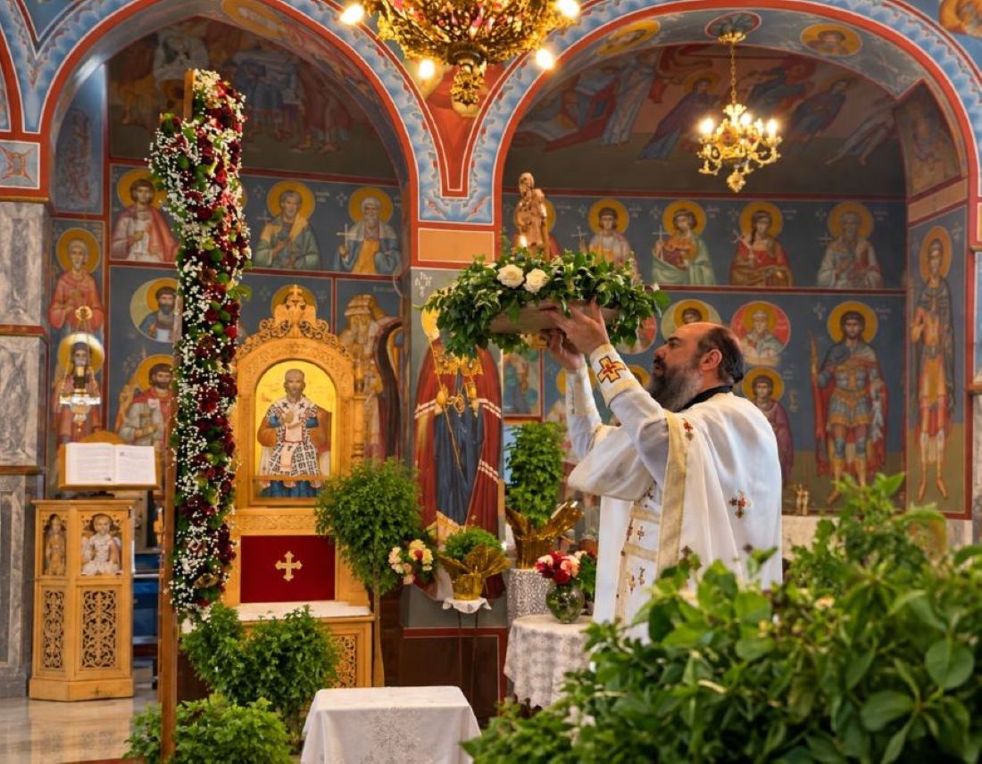 Basil surrounds the Cross as worshippers gather for the Feast of the Holy Cross, preserving a centuries-old Greek tradition that carries the blessing from church into the home.