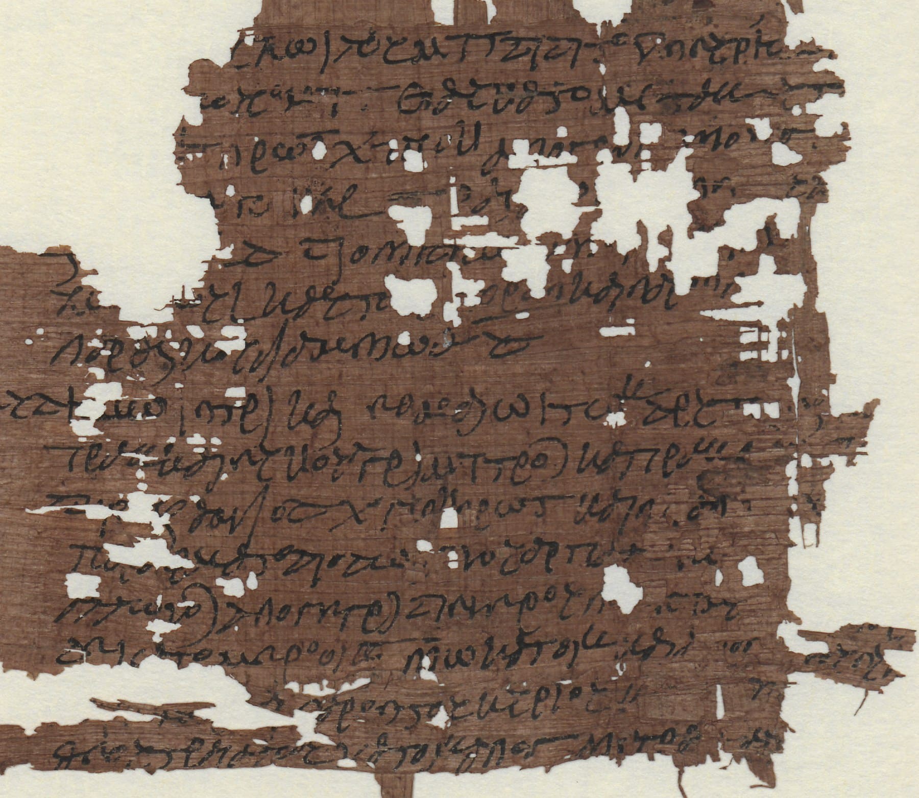 Ancient Greek papyrus with damaged sections and missing text
