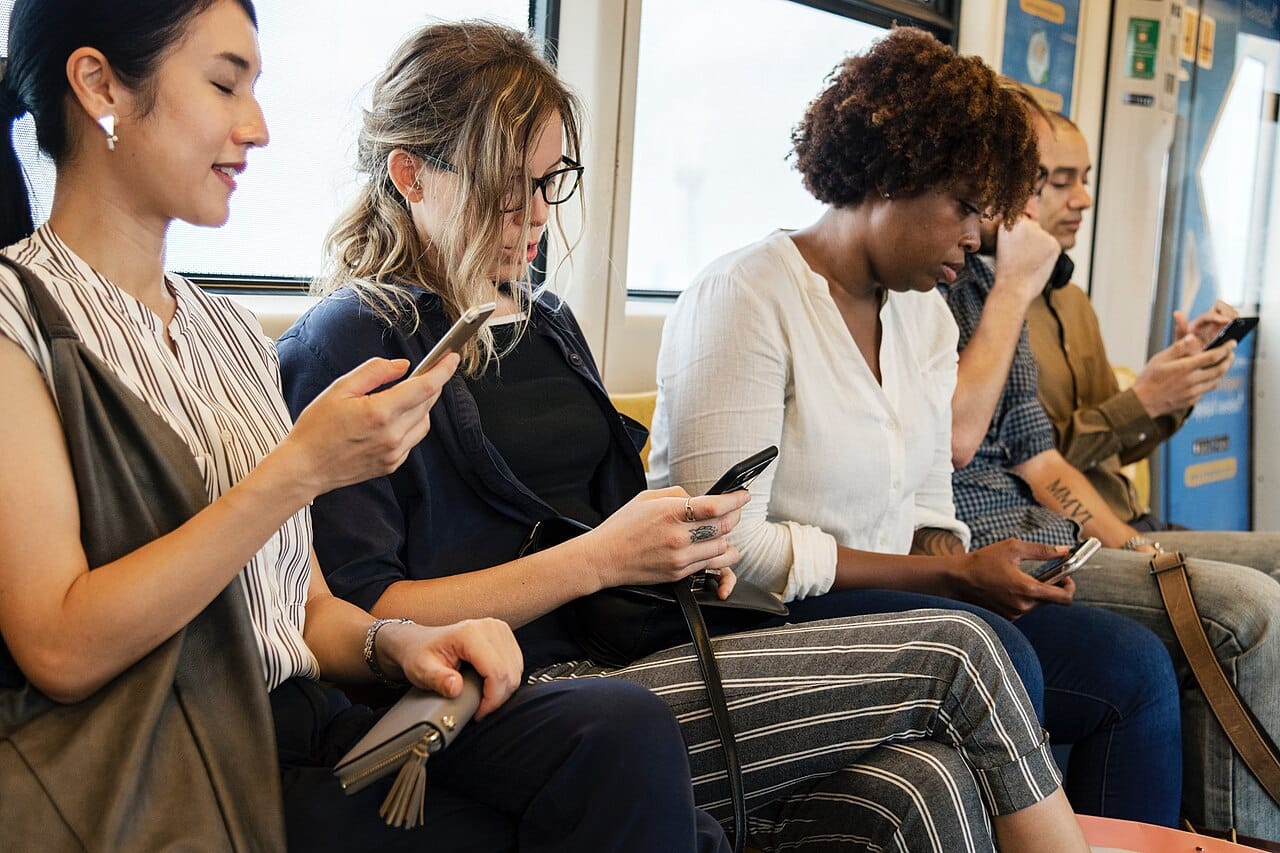 Diverse people using phones