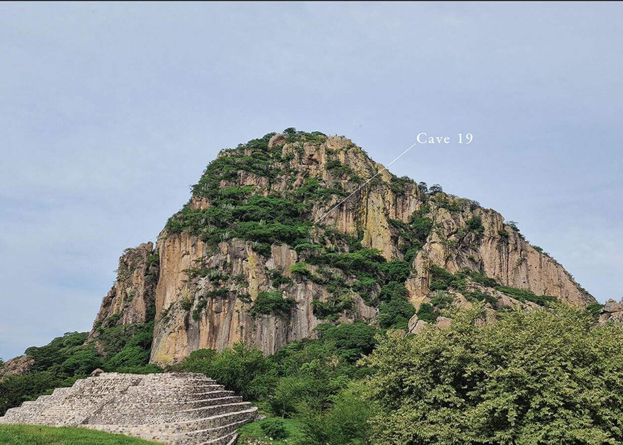 The western face of the Cerro Delgado (top), showing the location of Cave 19