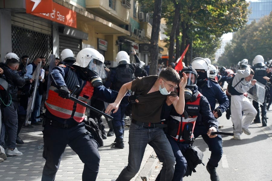 Riot police officers detain a protester during a university student demonstration against rising education costs and alleged government corruption in Tirana, Albania, on October 15, 2026. Credit: Malton Dibra/EPA/ANA-MPA.