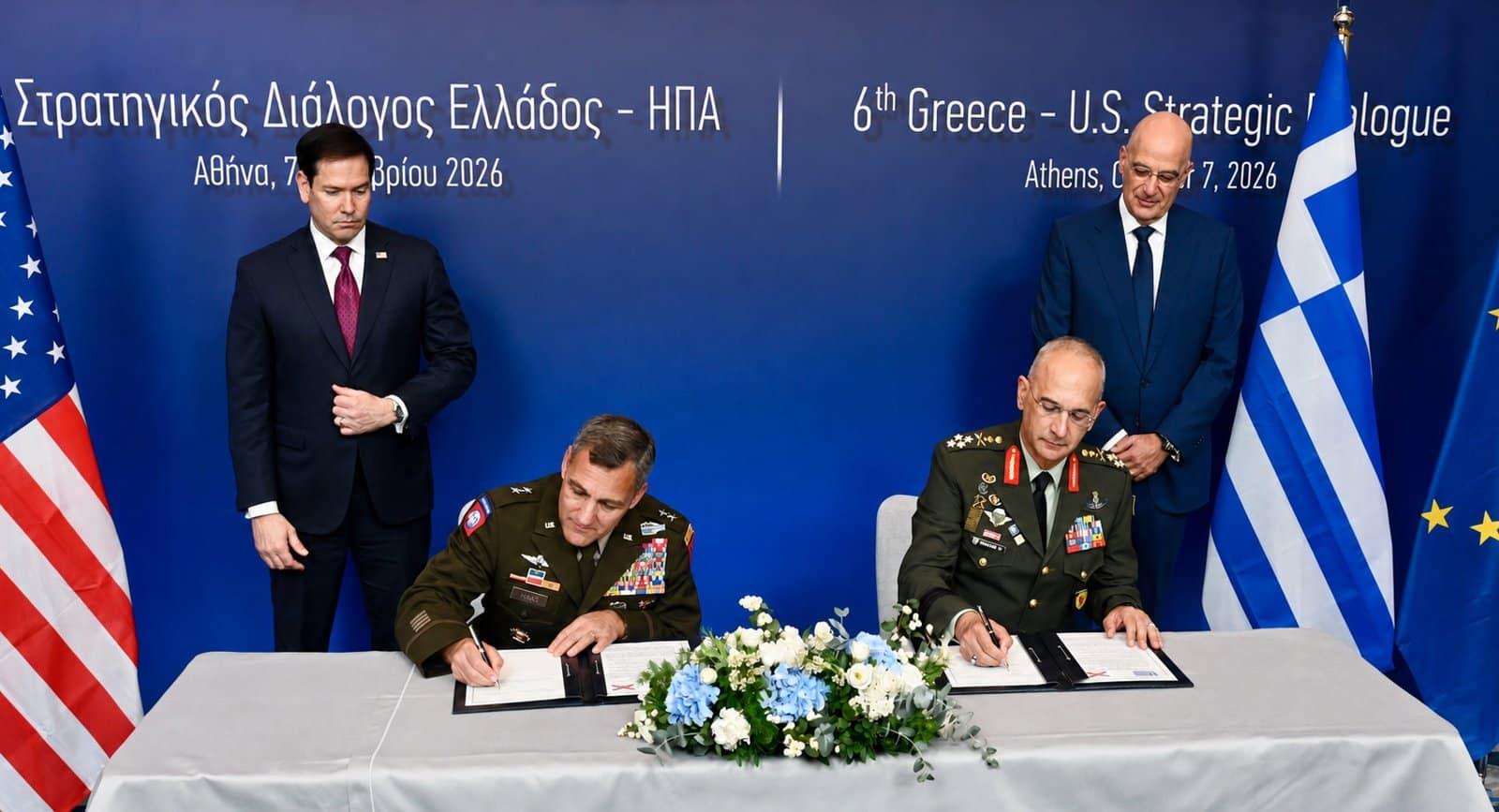 U.S. Secretary of State Marco Rubio and Greek Defense Minister Nikos Dendias watch as two military generals sign a bilateral defense cooperation agreement during the 6th Greece-U.S. Strategic Dialogue.