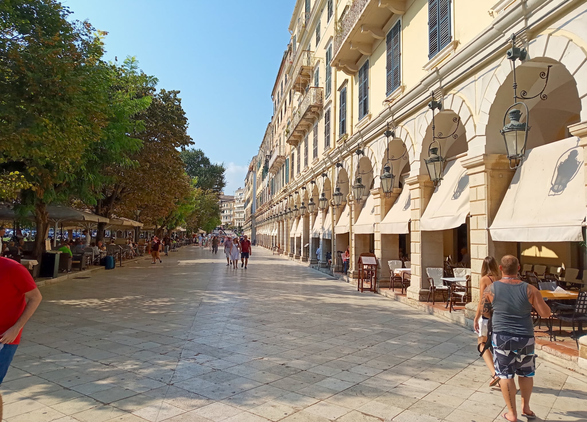 Spianada Square in Corfu, Greece, is widely regarded as the largest square in the Balkans. Originally created by the Venetians for military defense, it is now a landmark of the island’s historic Old Town.