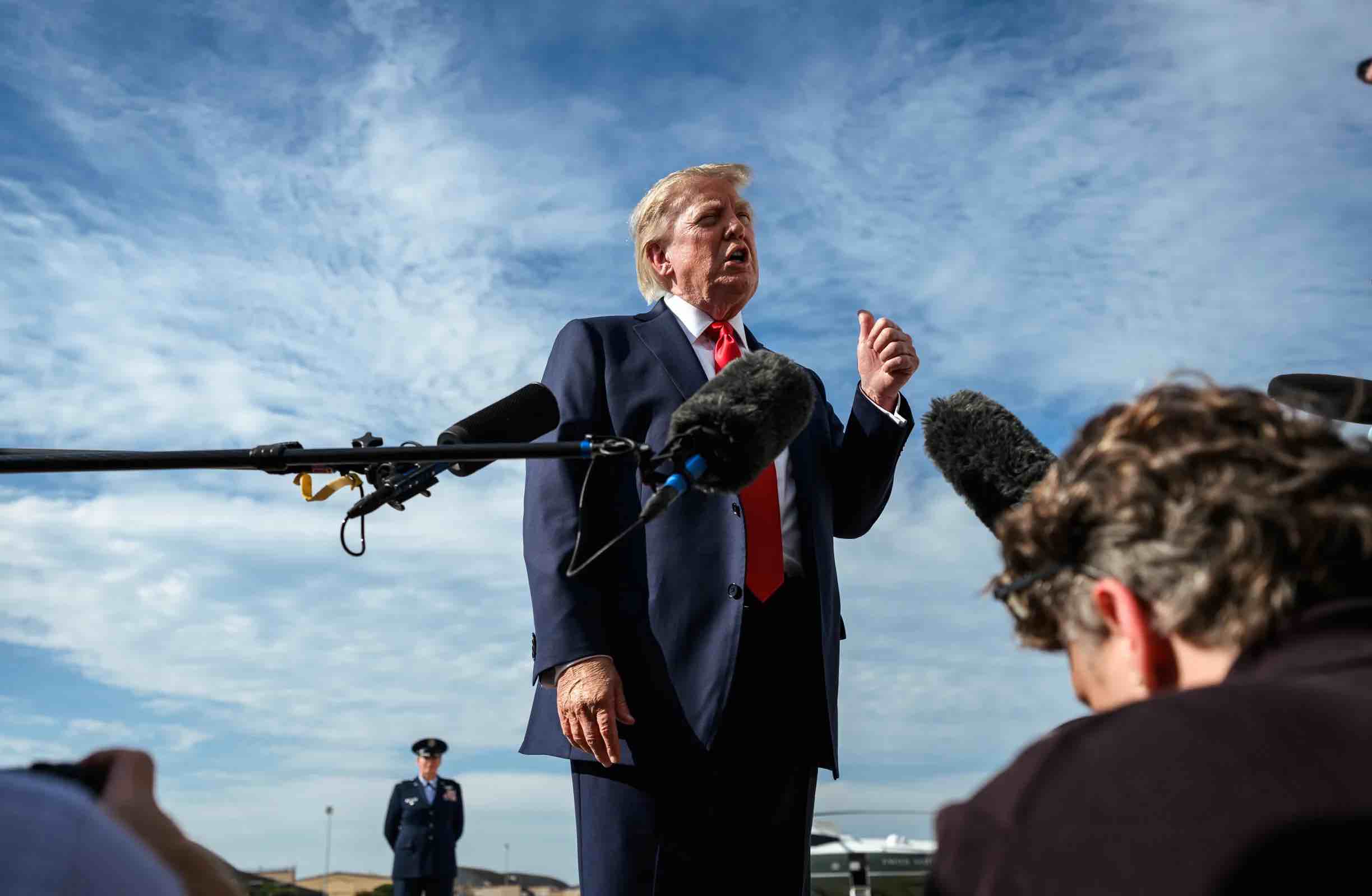 Trump speaks to media reporters