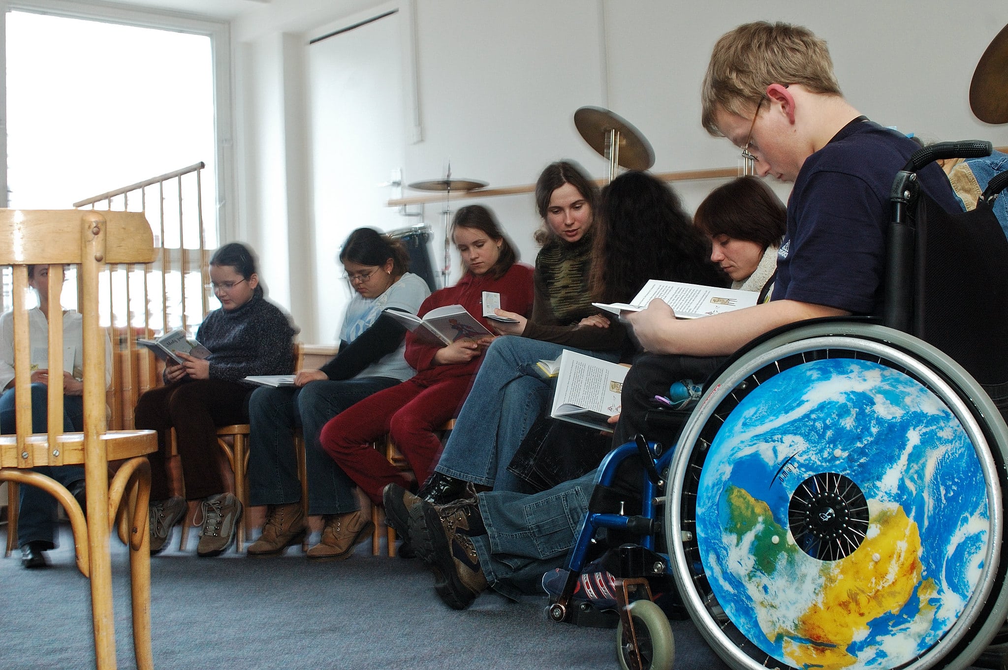 Disabled students read in a classroom