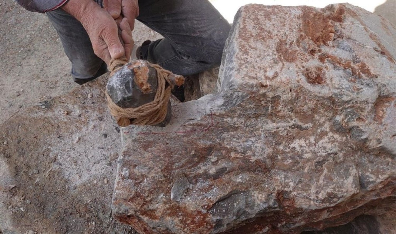 Experimental stone tool fitted with a wooden handle to reconstruct ancient Minoan stoneworking techniques