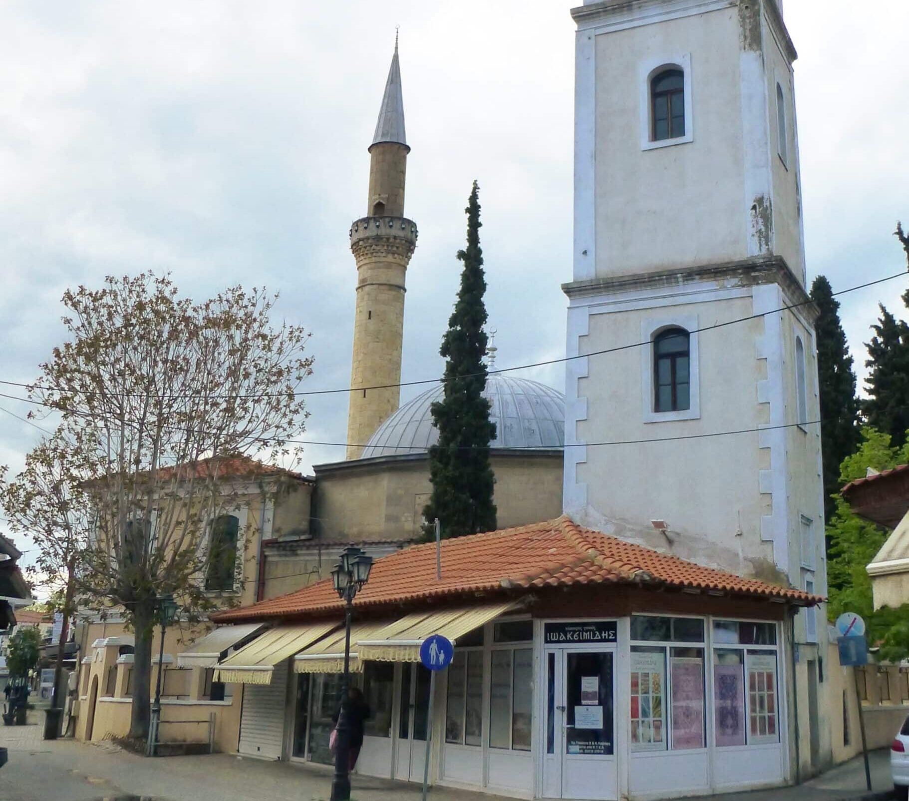 Clock tower beside a mosque minaret in Komotini.