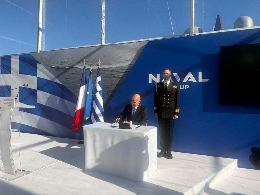 Greek Defense Minister Nikos Dendias signs documents during the handover and Greek flag-raising ceremony for the Hellenic Navy’s second Belharra (FDI HN) frigate, Nearchos, at the Naval Group shipyards in Lorient, France, on October 30, 2026. Photo: ANA-MPA/Stringer.