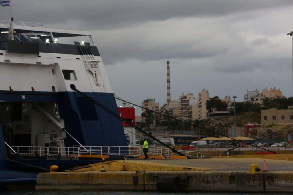 A ferry is docked at the port of Piraeus on October 26, 2026, a day after a car plunged into the sea during disembarkation, killing three members of the same family.